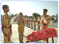 Major General Khadim Hussain, General Officer Commanding, offering fateha at the Grave of Major Muhammad Akram Shaheed